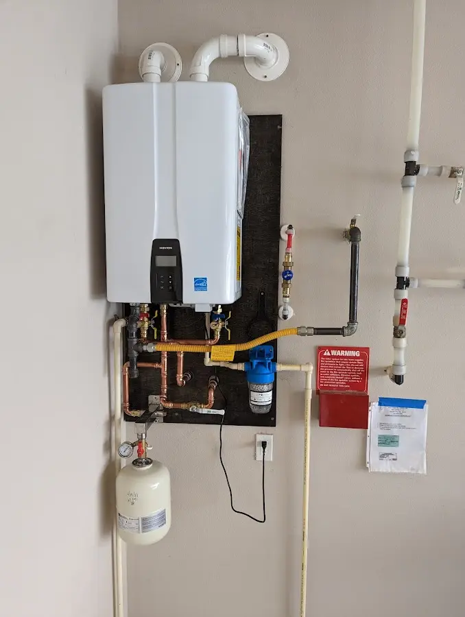 Professional plumber installing copper piping in a Pecan Grove home